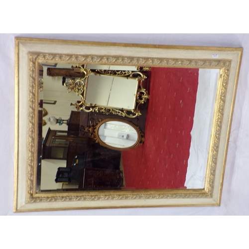 118 - Ornate gilt framed bevelled glass wall mirror with foliate decorated frame