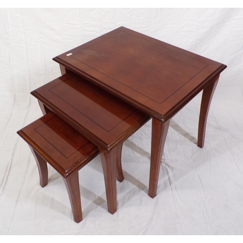 126 - Nest of three inlaid mahogany tables of graduating sizes, with shaped legs