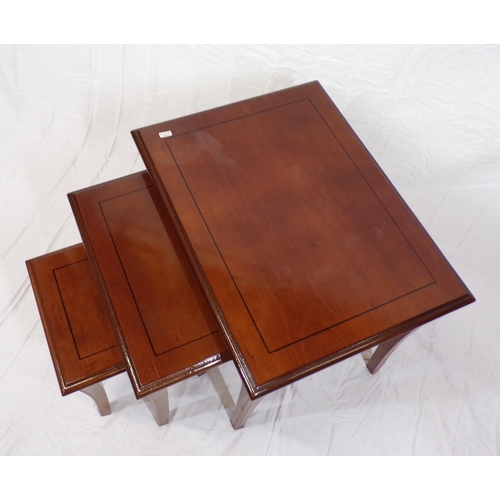 126 - Nest of three inlaid mahogany tables of graduating sizes, with shaped legs