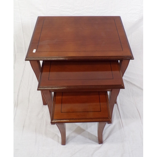 126 - Nest of three inlaid mahogany tables of graduating sizes, with shaped legs