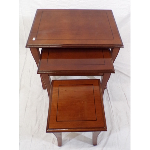 126 - Nest of three inlaid mahogany tables of graduating sizes, with shaped legs