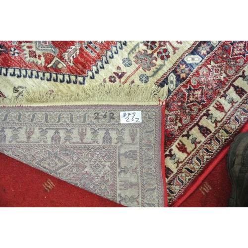 134 - Full pile red ground Persian Kashan carpet with floral medallion design 290x200cm