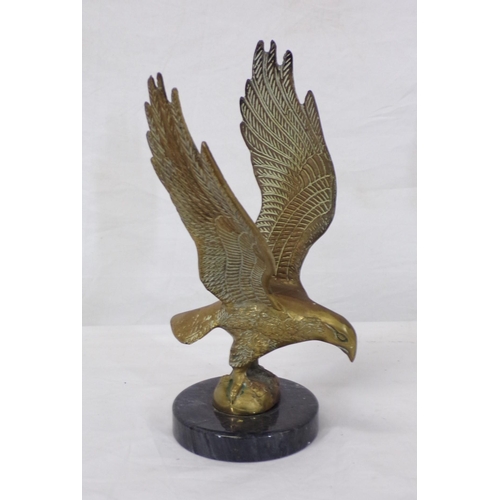 174 - Ornate brass figure of an eagle, on marble base