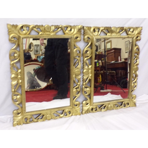 227 - Pair of ornate gilt framed mirrors with scroll decoration 82x60cm each