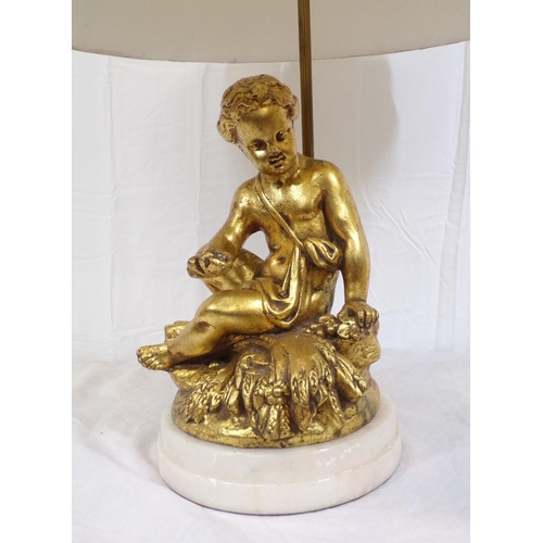 27 - Electric table lamp with ornate gilded figure, on round marble base