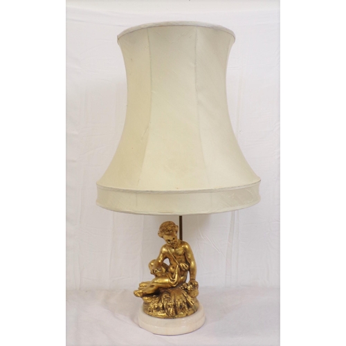 27 - Electric table lamp with ornate gilded figure, on round marble base