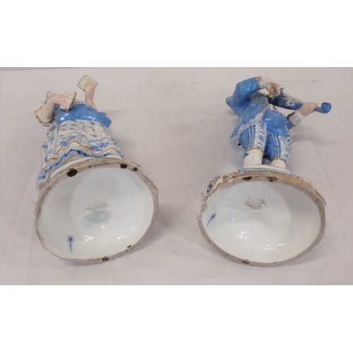 289 - Pair of Meissen figures of a lady with book and violinist, on foliate decorated bases