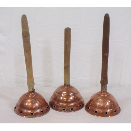 38 - Set of three shaped  copper plungers with timber handles