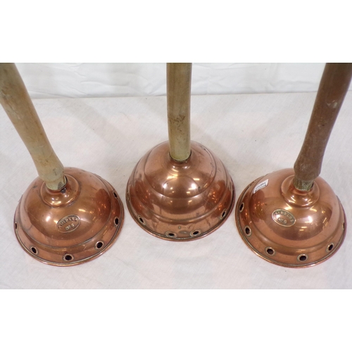 38 - Set of three shaped  copper plungers with timber handles