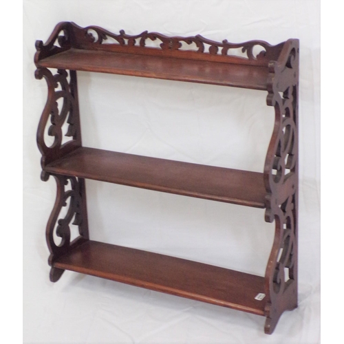 47 - Edwardian mahogany three tier wall shelf with ornate fretwork sides