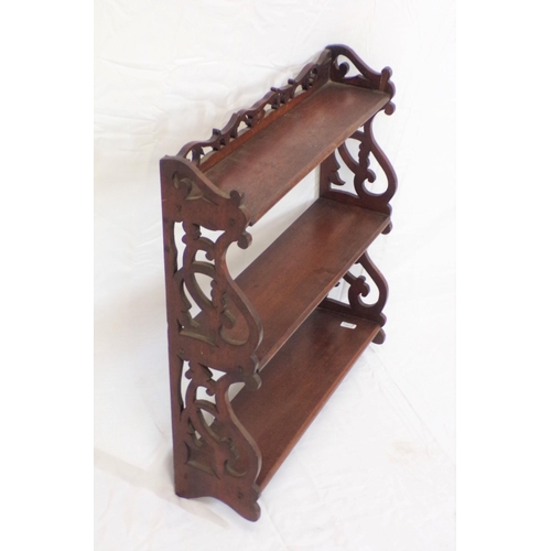 47 - Edwardian mahogany three tier wall shelf with ornate fretwork sides