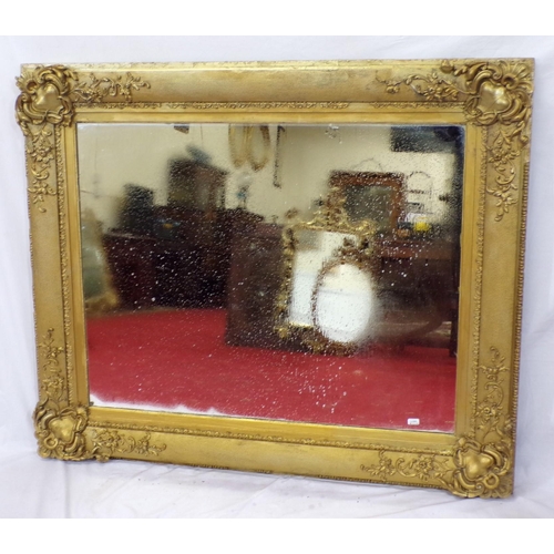 48 - Large gilt framed wall mirror with ornate scroll and foliate decoration