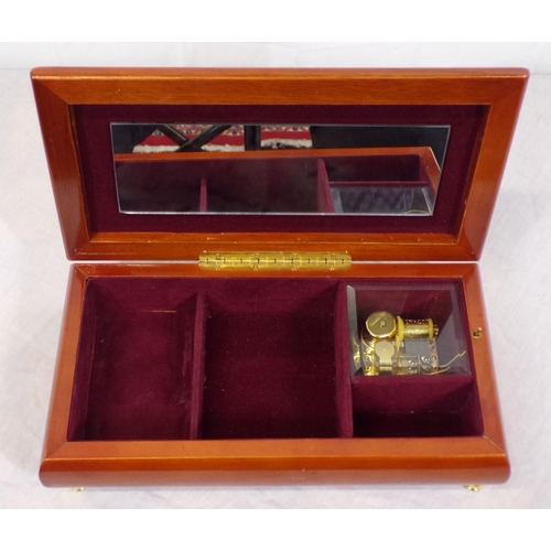 67 - Ornate mahogany jewellery music box with sectioned interior and mirror inset, with brass works