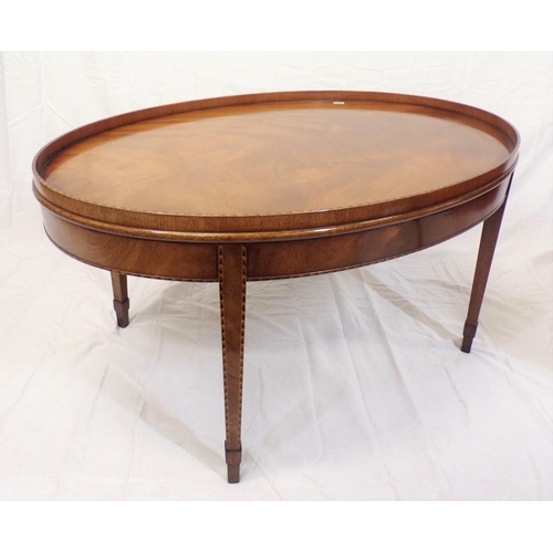 71 - Edwardian inlaid mahogany oval occasional or coffee table with raised rim, on herringbone inlaid tap... 