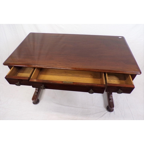 75 - Edwardian mahogany hall or side table with three frieze drawers, round handles, shaped finials, tape... 