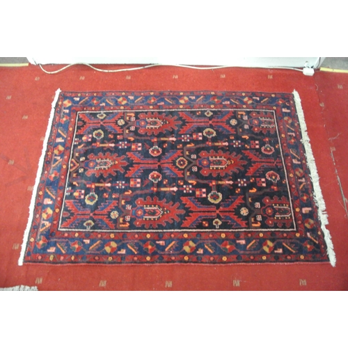 77 - Persian full pile rug with ornate foliate decoration