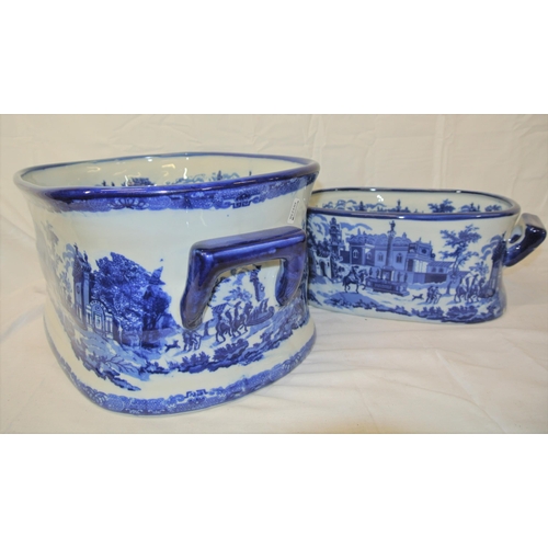 146 - Two Staffordshire style footbaths or bowls with blue and white scenic decoration and shaped handles