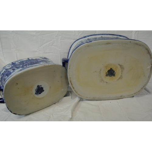 146 - Two Staffordshire style footbaths or bowls with blue and white scenic decoration and shaped handles