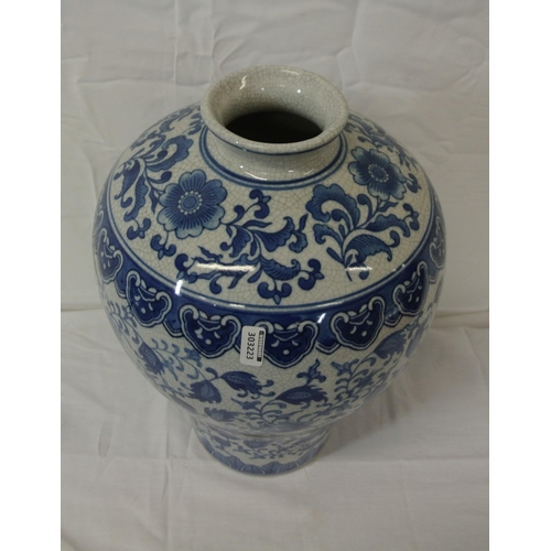 152 - Oriental style baluster shaped ginger jar with blue and white foliate decoration