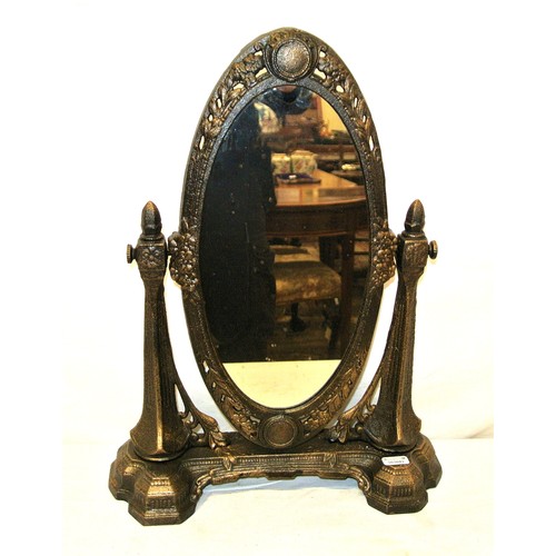 34 - Ornate metal framed oval swivel mirror with shaped columns and foliate decorated base