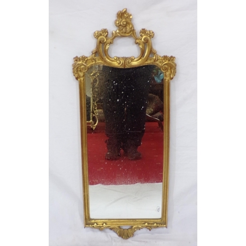 107 - Regency design gilt framed oblong wall mirror with ornate scroll and foliate decoration