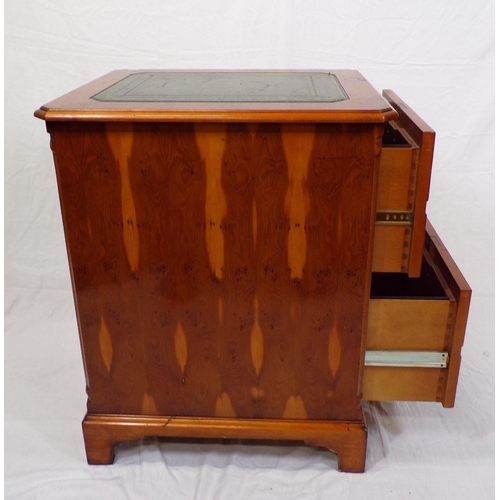 16 - Edwardian design yew cabinet with leatherette inset, two double drawers with drop handles, on bracke... 