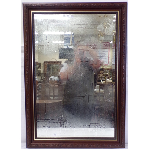 22 - Edwardian bevelled glass wall mirror with foliate frame