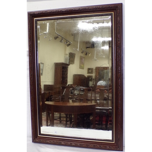 22 - Edwardian bevelled glass wall mirror with foliate frame