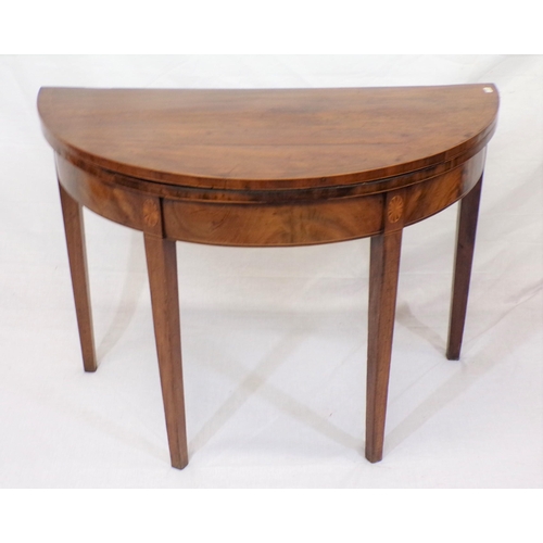 91 - Edwardian inlaid mahogany demi-lune card table with fold-over top, on tapering legs