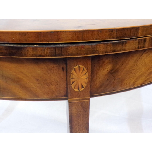 91 - Edwardian inlaid mahogany demi-lune card table with fold-over top, on tapering legs