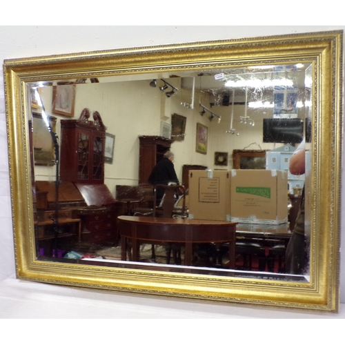 114 - Edwardian style gilt framed bevelled wall mirror with foliate decoration