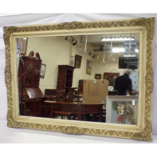 124 - Oblong wall mirror in foliate carved frame