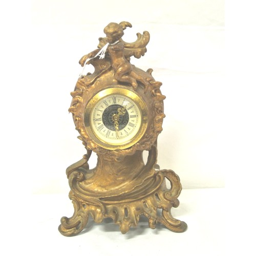 168 - French style ormolu mantle clock with cherub and foliate decoration, circular enamel dial, and shape... 