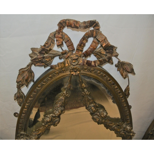 182 - Regency style triple oval bevelled mirrors with ornate foliate and scroll decorated frames