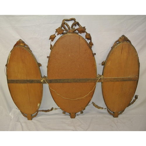 182 - Regency style triple oval bevelled mirrors with ornate foliate and scroll decorated frames