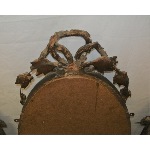 182 - Regency style triple oval bevelled mirrors with ornate foliate and scroll decorated frames