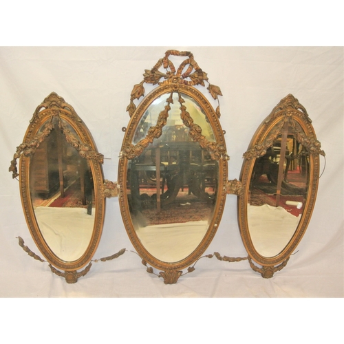 182 - Regency style triple oval bevelled mirrors with ornate foliate and scroll decorated frames