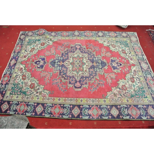 218 - Full pile red ground Persian Kashan carpet with floral medallion design 290x200cm