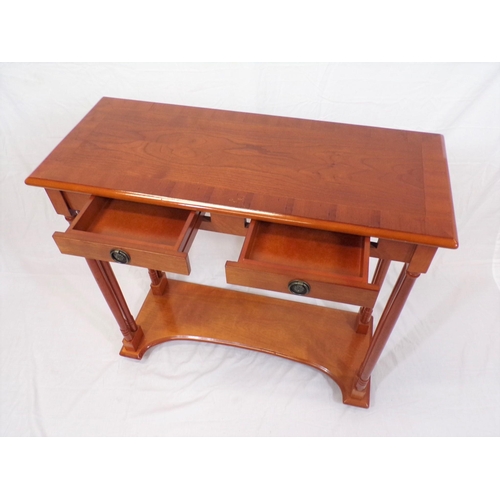 10 - Edwardian design yew console table with two frieze drawers, turned columns, on shaped plinth