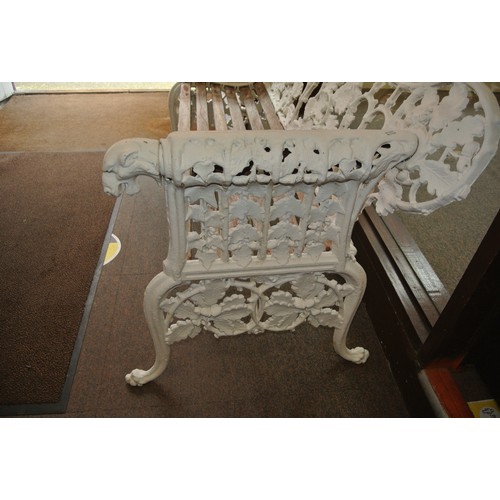 294 - Pair of cast iron Coalbrookdale style garden benches with ornate leaf and doghead decoration, on sha... 