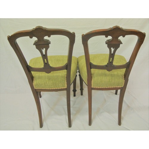 297 - Pair of Victorian mahogany chairs with pierced splats, upholstered seats, on turned tapering legs