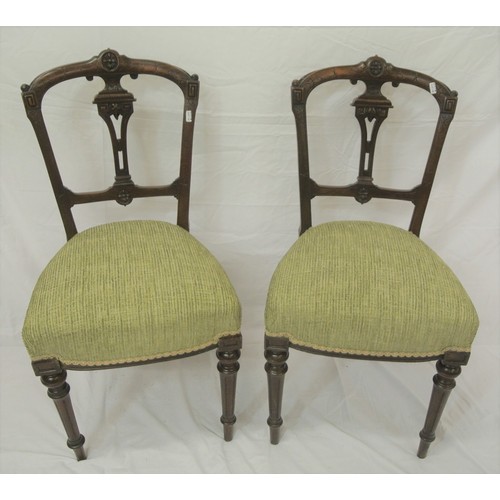 297 - Pair of Victorian mahogany chairs with pierced splats, upholstered seats, on turned tapering legs