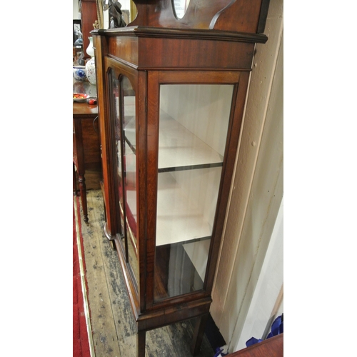 100 - Edwardian inlaid mahogany display cabinet with shaped top, oval bevelled mirror inset, glazed doors,... 