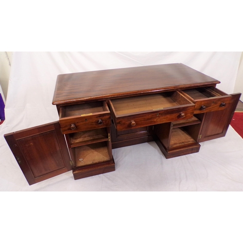 110 - Edwardian mahogany pedestal desk with three frieze drawers, shelved presses with panelled doors, on ... 