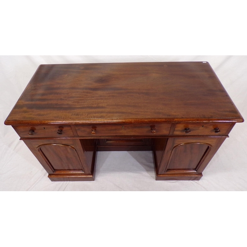 110 - Edwardian mahogany pedestal desk with three frieze drawers, shelved presses with panelled doors, on ... 