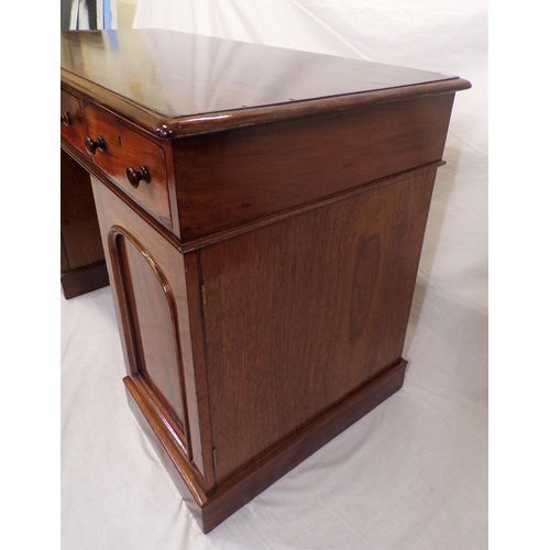 110 - Edwardian mahogany pedestal desk with three frieze drawers, shelved presses with panelled doors, on ... 