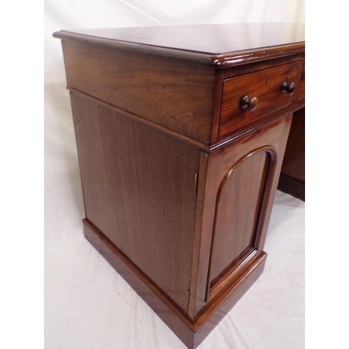 110 - Edwardian mahogany pedestal desk with three frieze drawers, shelved presses with panelled doors, on ... 