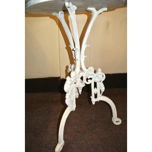 111 - Cast iron garden table with round marble top and shaped legs