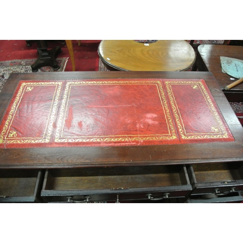 125 - Edwardian pedestal office desk with leatherette inset, three frieze drawers, six pedestal drawers, w... 