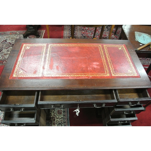 125 - Edwardian pedestal office desk with leatherette inset, three frieze drawers, six pedestal drawers, w... 